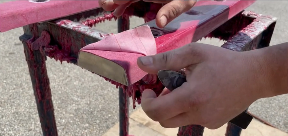 Insulating material being prepared on a railway joint component